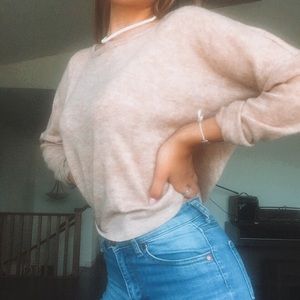 orange cream coloured sweater